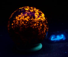 Load image into Gallery viewer, Fluorescent Yooperlite 64mm Sphere for Home Decor or UV Collection NS2
